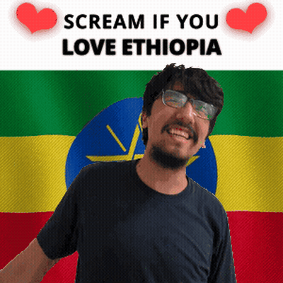 Smiling Man With Glasses By Ethiopian Flag Scream If You Love Ethiopia GIF