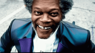 Smiling Man With Gray Hair In Blue And Purple Suit GIF