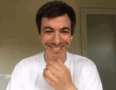Smiling Man With Hand On Chin GIF