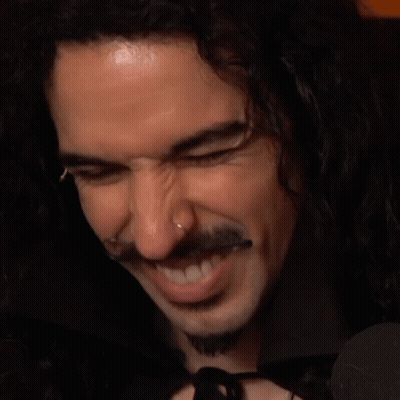 Smiling Man With Long Curly Hair And Beard GIF