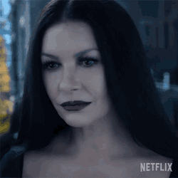 Smiling Morticia Addams GIF