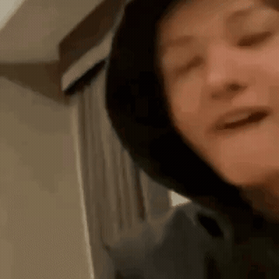 Smiling Person In Hoodie GIF