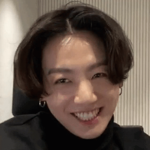 Smiling Person With Turtleneck And Earrings GIF