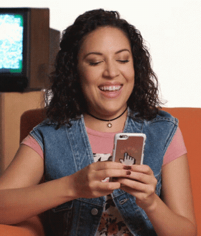 Smiling Woman Holding Cell Phone GIF