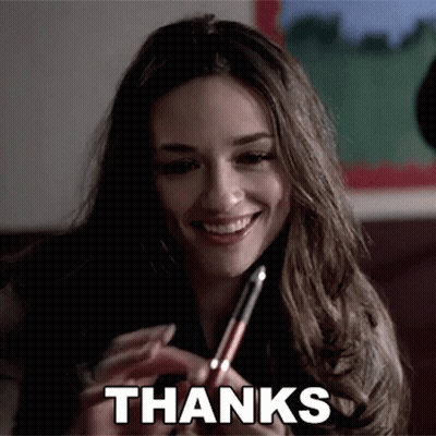 Smiling Woman Holding Pen With Thanks GIF