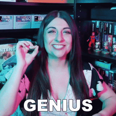Smiling Woman Holding Small Object By Genius Shelf GIF