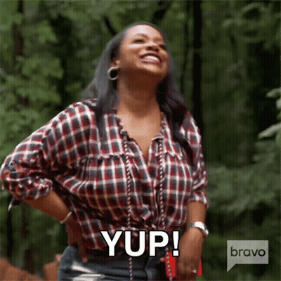 Smiling Woman In Plaid Shirt Says Yup GIF