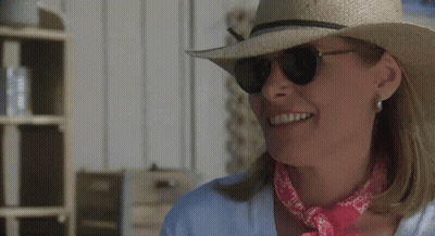 Smiling Woman In Straw Hat And Sunglasses With Pink Bandana GIF
