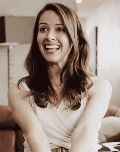 Smiling Woman In White Tank Top GIF