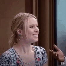 Smiling Woman Sitting By Window GIF