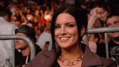 Smiling Woman Sitting In Boxing Ring Stands GIF