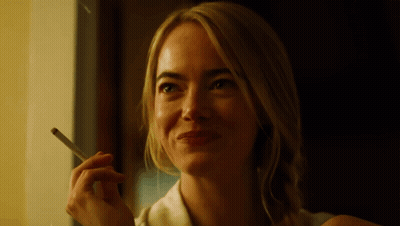 Smiling Woman Smoking Cigarette GIF
