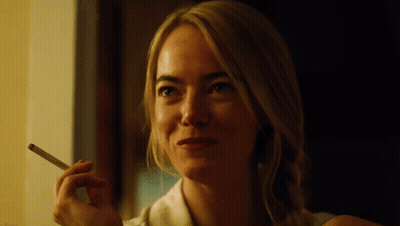 Smiling Woman Smoking Cigarette GIF