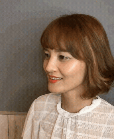 Smiling Woman With Brown Hair And Red Lipstick GIF
