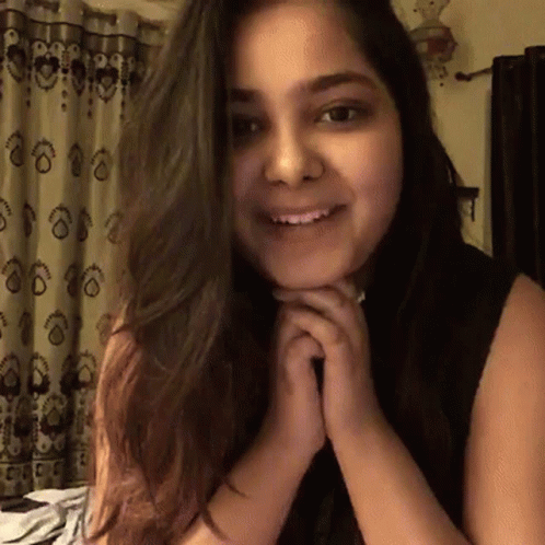 Smiling Woman With Folded Hands GIF