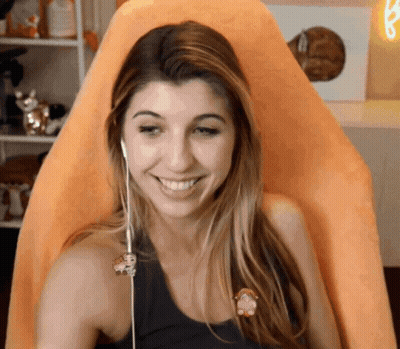 Smiling Woman With Headphones And Monkey Pin GIF