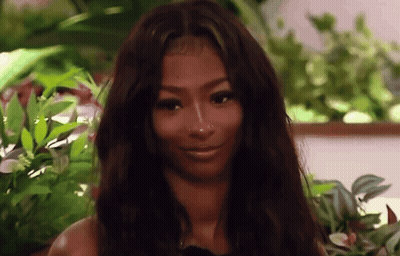 Smiling Woman With Long Dark Hair And Nose Ring GIF