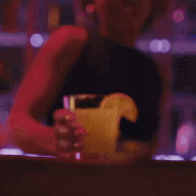 Smiling Woman With Ponytail Holding Coffee GIF