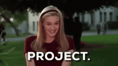 Smiling Woman With Project On Face GIF