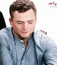 Smitten Flirty Taron Egerton GIF