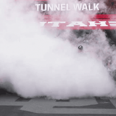 Smoke Coming Out Of A Car With A Sign That Says Tunnel Walk GIF