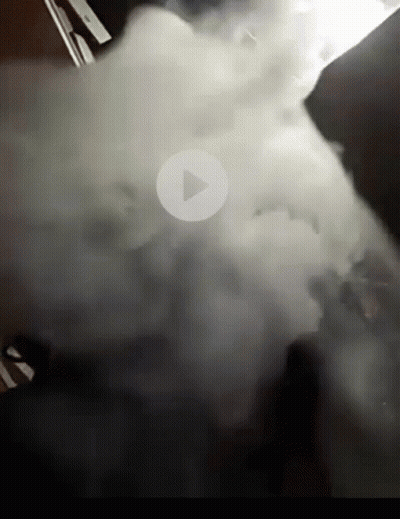 Smoke Filled Room With Play Button GIF