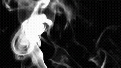Smoke Is Coming Out Of A Pipe On A Black Background In A Black And White Photo . GIF