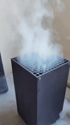 Smoke Is Coming Out Of The Top Of An Xbox GIF