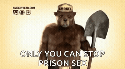 Smokey The Bear Is Holding A Shovel And Wearing A Fireman 'S Hat . GIF