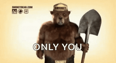 Smokey The Bear Is Wearing A Hat And Holding A Shovel And Says `` Only You '' . GIF