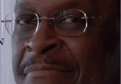 Smug Herman Cain Smiling GIF