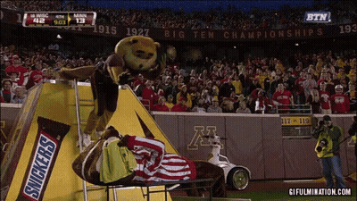 Snickers Bar Mascot On Football Field GIF