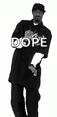 Snoop Dogg Is Dancing In A Black And White Photo While Wearing A Dope Shirt . GIF