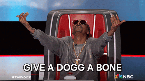 Snoop Dogg Is Sitting In A Chair With His Arms Outstretched And The Words Give A Dogg A Bone Below Him GIF