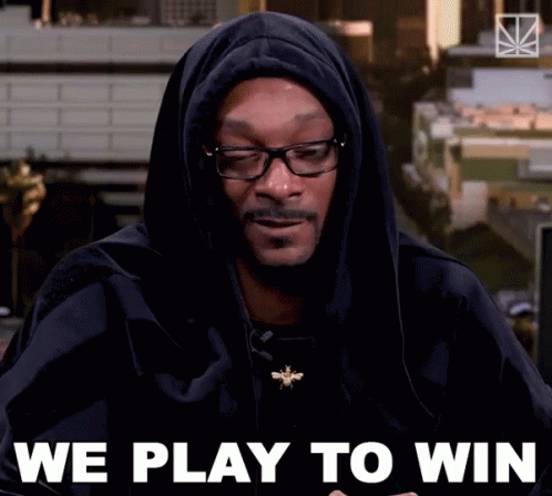 Snoop Dogg Is Wearing A Black Hoodie And Glasses And Says " We Play To Win " GIF