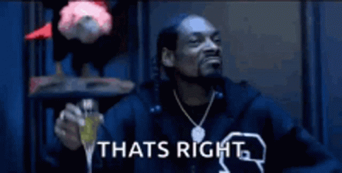 Snoop Dogg Is Wearing A Fur Coat And Giving A Thumbs Up Sign . GIF