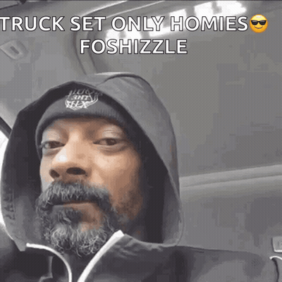 Snoop Dogg Is Wearing A Hooded Jacket And A Beanie GIF