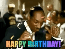 Snoop Dogg Is Wearing A Suit And Tie And Singing A Happy Birthday . GIF