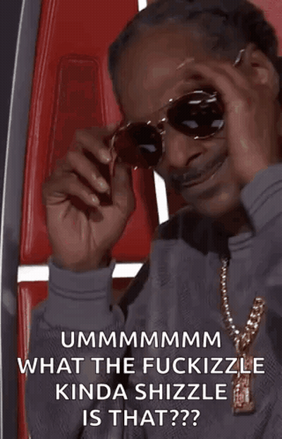 Snoop Dogg Is Wearing Sunglasses And A Necklace While Sitting In A Red Chair . GIF