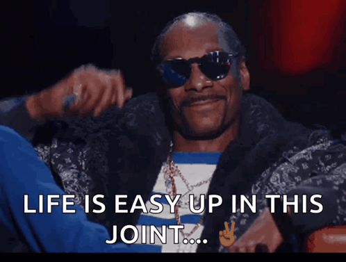 Snoop Dogg Is Wearing Sunglasses And Smoking A Cigarette With The Words Life Is Easy Up In This Joint Below Him GIF