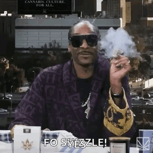 Snoop Dogg Is Wearing Sunglasses And Smoking A Marijuana Cigarette . GIF
