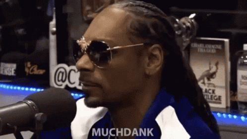 Snoop Dogg Is Wearing Sunglasses And Talking Into A Microphone While Saying Muchdank . GIF