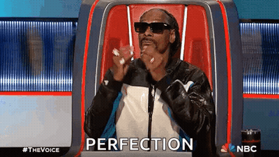 Snoop Dogg Sitting With Hands In Pockets GIF