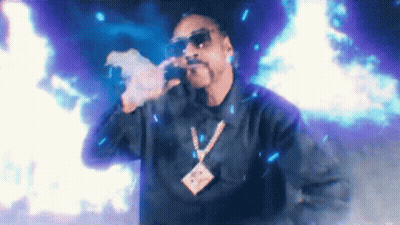 Snoop Dogg Smoking Cigarette And Singing Into Microphone GIF