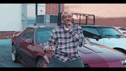 Snoop Dogg Smoking In Car Shop GIF