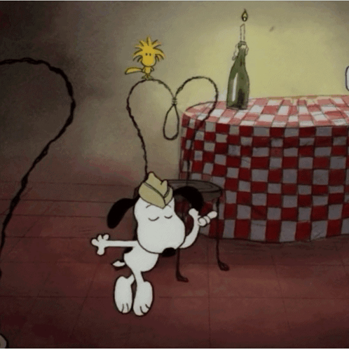 Snoopy And Woodstock Are Dancing In Front Of A Table With A Checkered Tablecloth GIF
