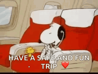 Snoopy Is Sitting On An Airplane Talking On A Telephone . GIF