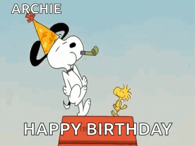 Snoopy Is Wearing A Party Hat And Blowing A Party Horn While Woodstock Is Standing On A Box . GIF