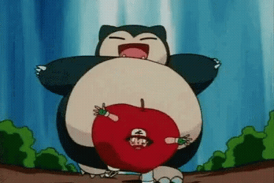 Snorlax From Pokemon Is Holding A Red Apple With Ash In It . GIF