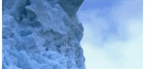 Snow Pile Falling Down Cliff GIF